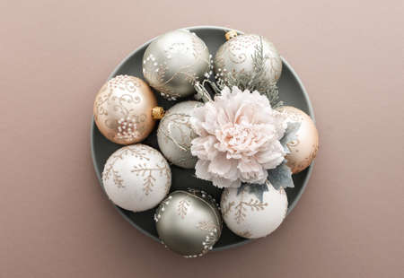 Christmas balls and decorative flowers on powdery background, Merry Christmas and Happy New Year concept, top view, copy spaceの写真素材