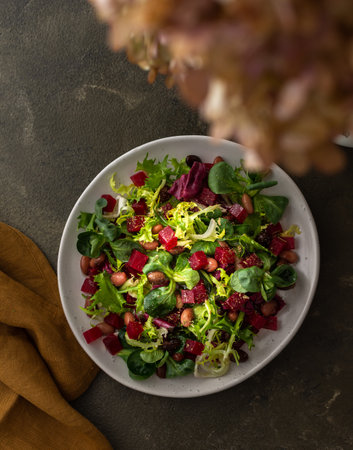 Warm salad with mixed salad with boiled beetroot and beans with spices, top viewの写真素材