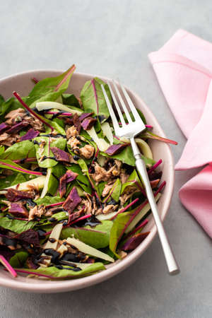 Beetroot leaves Chard with canned tuna and baked purple sweet potato and mozzarella, healthy fresh salad with balsamic vinegarの写真素材