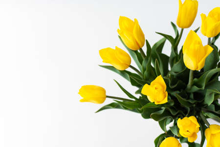 Beautiful spring bouquet of yellow tulips, top view of the bouquetの写真素材