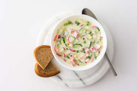 Cold soup Okroshka, soup with fresh vegetables and kefir, delicious summer traditional Ukrainian or Russian soupの写真素材