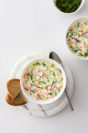 Cold soup Okroshka, soup with fresh vegetables and kefir, delicious summer traditional Ukrainian or Russian soupの写真素材