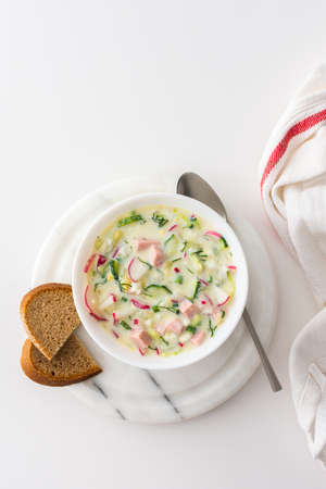 Cold soup Okroshka, soup with fresh vegetables and kefir, delicious summer traditional Ukrainian or Russian soupの写真素材