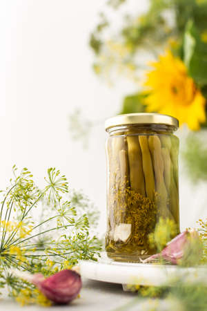 Preparing for autumn and winter, canned asparagus beans in jars, pickled or fermented vegetablesの写真素材