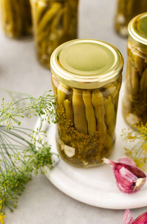 Preparing for autumn and winter, canned asparagus beans in jars, pickled or fermented vegetablesの写真素材
