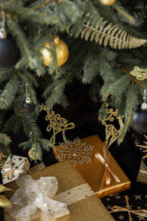 Gift boxes under the Christmas tree, Merry Christmas and Happy New Yearの写真素材