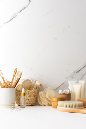 Wooden toothbrushes with natural bristles in a ceramic glass, face and skin care products, bath accessories, spa and beauty conceptの写真素材