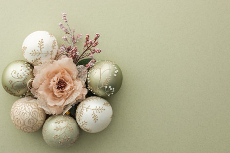Christmas balls and decorative flowers on green background, Merry Christmas and Happy New Year concept, top view, copy spaceの写真素材