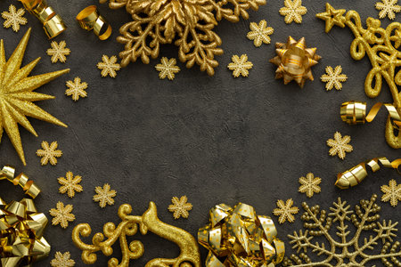 Merry Christmas and New Year, various festive decorative snowflakes and Christmas tree, deer and star, paper streamers in gold color on black backgroundの写真素材
