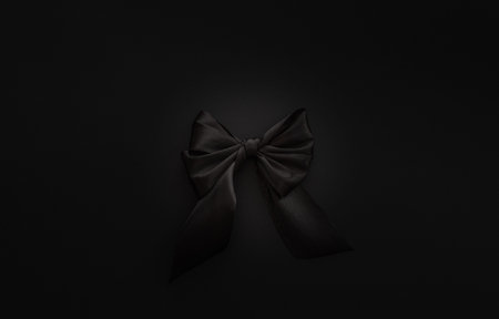 Closeup black bow on a black background, Black Friday conceptの写真素材