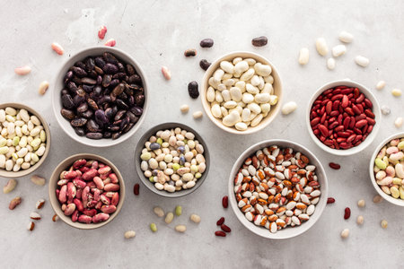 Different types of beans in bowls, economically important legume, top view, copy spaceの写真素材