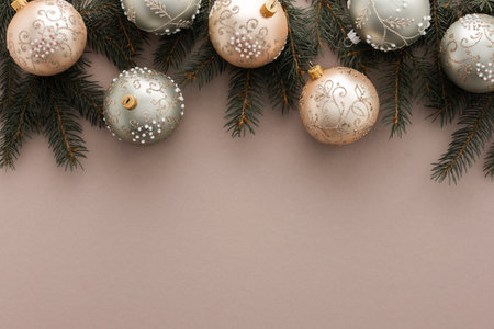 Christmas balls and spruce branches on powdery background, Merry Christmas and Happy New Year concept, top view, copy spaceの写真素材