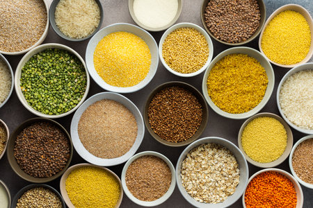 Various grain cereals in bowls on a light background, top viewの写真素材