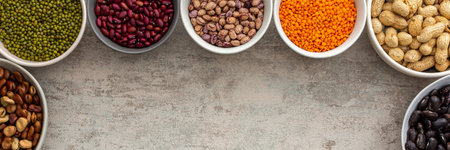 Banner of various types of legumes in bowls, green and yellow peas, chickpeas and peanuts, colored beans and lentils, mung beans and beans, top view, copy spaceの写真素材