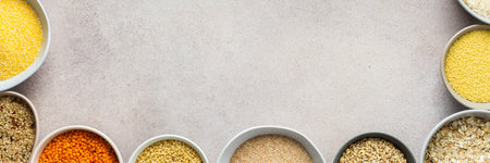 Various grain cereals in bowls banner, top viewの写真素材