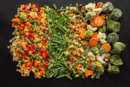 Frozen vegetable mix, frozen green beans and broccoli, corn and carrots, brussels sprouts and cauliflower, peas and bell peppers, eggplant and zucchini, top viewの写真素材
