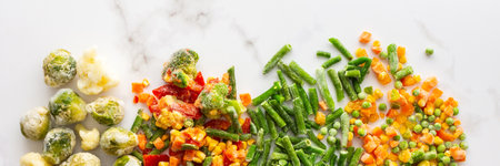 Frozen vegetable mix banner, frozen green beans and broccoli, corn and carrots, brussels sprouts and cauliflower, peas and bell peppers, copy space, top viewの写真素材