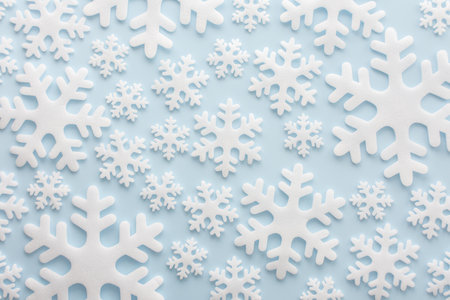 White snowflakes on a blue background, Christmas background, Merry Christmas and Happy New Year concept, top viewの写真素材