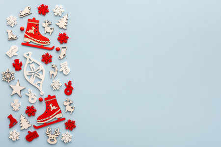 White and red Christmas toys on a blue background, Merry Christmas and Happy New Year concept, top view, copy spaceの写真素材