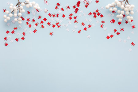 White and red snowflakes and rowan branches on a blue background, Christmas background, Merry Christmas and Happy New Year concept, top view, copy spaceの写真素材