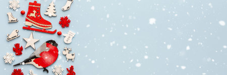 White and red Christmas toys on a blue background, Merry Christmas and Happy New Year banner, top...