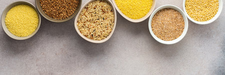 Various grain cereals in bowls banner, top viewの写真素材