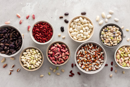 Different types of beans in bowls, economically important legume, top view, copy spaceの写真素材