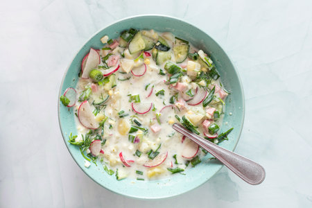 Cold summer soup Okroshka, soup with vegetables and sausage, eggs and fresh herbs and yogurt, traditional Russian soupの写真素材