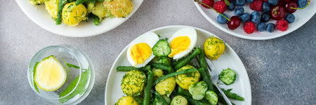 Delicious lunch or dinner banner, boiled young potatoes with asparagus beans and young fresh...