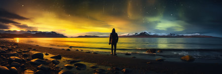 Traveler in a raincoat against the backdrop of Iceland landscapes, glaciers and mountains, black sand and northern lights, bannerの素材