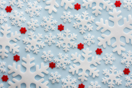 White and red snowflakes on a blue background, Christmas background, Merry Christmas and Happy New Year concept, top view, copy spaceの写真素材