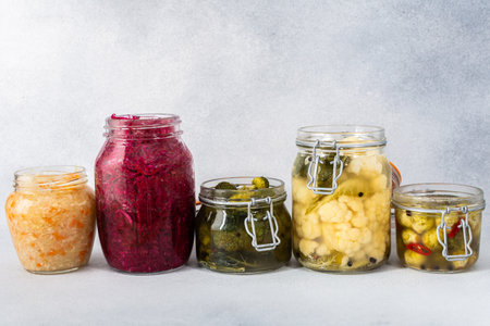 Cabbage fermentation, white cabbage with carrots and sweet peppers, red cabbage with onions, broccoli and Brussels sprouts and cauliflower, sauerkrautの写真素材