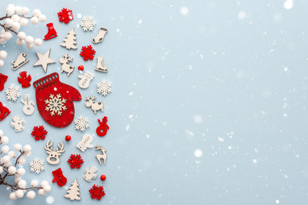 White and red Christmas toys on a blue background and snow, Merry Christmas and Happy New Year concept, top view, copy spaceの写真素材