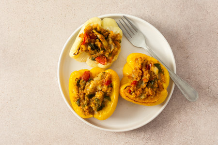 This nutritious dish of stuffed bell peppers with quinoa, lentils, and vegetables makes for a hearty, plant-based meal thats both flavorful and satisfyingの写真素材