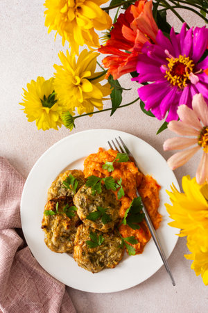 Savor a colorful, balanced breakfast of zucchini pancakes served with a homemade zucchini, tomato, and bell pepper caviar, perfect for a nutritious, plant-based dietの写真素材