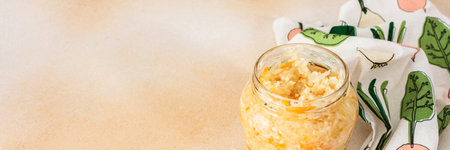 Fermenting fresh cabbage, white cabbage with carrots in a jar, sauerkraut, bannerの写真素材