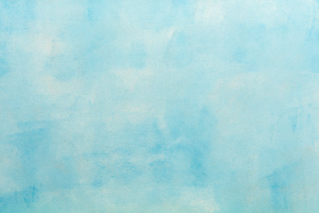 Abstract soft blue background with a subtle texture, perfect for adding copy space and elegant design elements, top view and copy spaceの写真素材