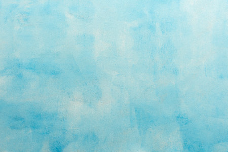 A minimalist soft blue texture backdrop, offering soft tones and a clean surface for creative design, top view and copy spaceの写真素材