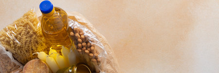 Essential home food stock for military operations and crises and for the period of quarantine and isolation, canned food and pasta, flour and nonperishable items,the concept of stay at home, bannerの写真素材