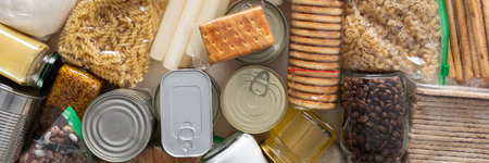 Canned goods, cereals and pasta stored for quarantine and isolation, ensuring long-term survival and food security at home, survival during military operations, the concept of stay at home, bannerの写真素材