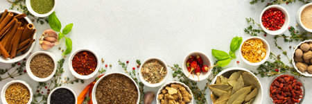 Colorful, fresh herbs and spices framing a gray background, a perfect natural border to bring attention to culinary creativity, top view, copy space, bannerの写真素材