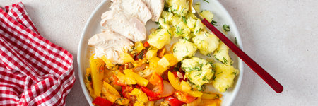A wholesome dish featuring boiled potatoes, baked vegetables, chicken breast, and a vibrant salad with seeds, delicious healthy food, bannerの写真素材