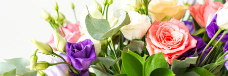 This seasonal bouquet of roses, eucalyptus, and eustoma in soft pink, white, and purple tones makes an ideal gift for anniversaries, birthdays, bannerの写真素材