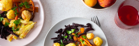 Savor a wholesome meal of baked vegetables like potatoes, zucchini, carrots, and beets, paired with fresh fruits and cherry compote, perfect for a healthy and satisfying start to your day bannerの写真素材