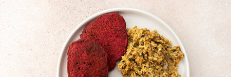 Beet pancakes with sunflower seed hummus - a tasty and nutritious vegetarian meal that brings maximum health benefits and enjoyment, bannerの写真素材