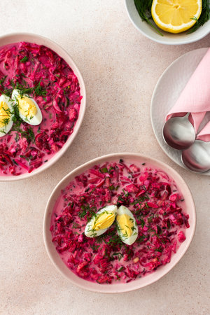 Summer cold beetroot soup made from beets, radishes, cucumbers, potatoes and herbs, garnished with egg, a refreshing summer lunchの写真素材