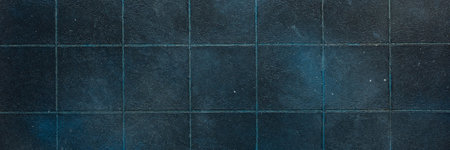 Dark blue tiles create a sleek and glossy background, adding depth and sophistication to any interior or design project, bannerの写真素材