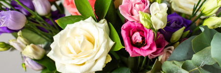 This seasonal bouquet of roses, eucalyptus, and eustoma in soft pink, white, and purple tones makes an ideal gift for anniversaries, birthdays, bannerの写真素材