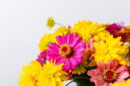 A summer bouquet featuring colorful Zinnia and Rudbeckia Goldquelle flowers adds vibrant beauty to home decoration, perfect for a seasonalの写真素材