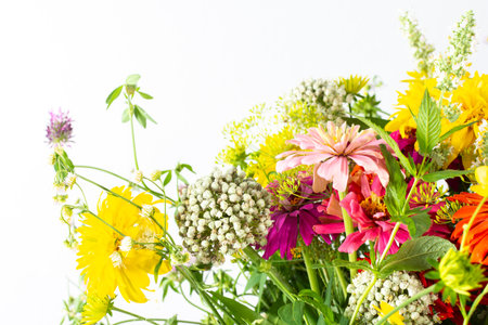 Summer bouquet of colorful Zinnia, onion inflorescences and mint sprigs, Rudbeckia Goldquelle and red clover, Ranunculus and Matricaria, home decoration with flowersの写真素材